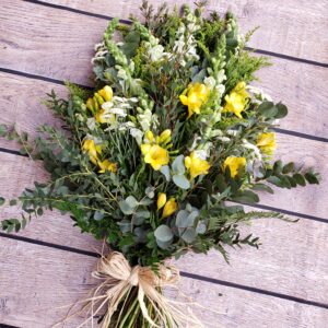 Yellow freesia sheaf, freesia flowers and white seasonal funeral flowers delivery in Torbay