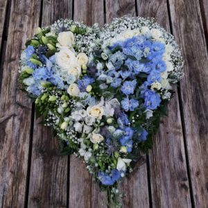 blue flowers-funeral flowers-heart design-heart tribute in white and blue flowers