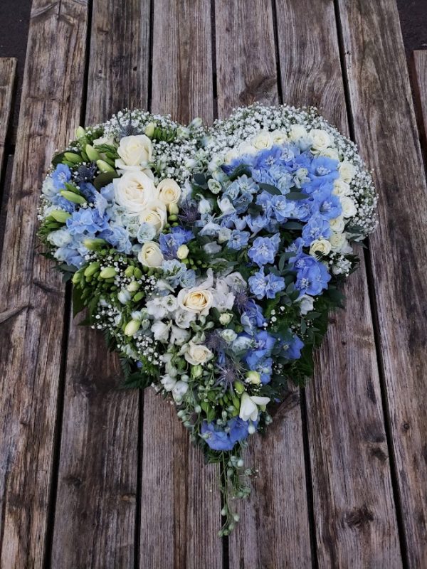 blue flowers-funeral flowers-heart design-heart tribute in white and blue flowers