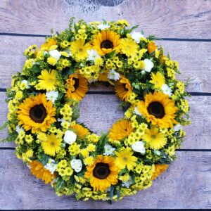 sunflower wreath for a funeral delivered to local funeral directors in Newton Abbot, Paignton, Torquay and Brixham