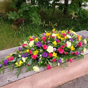 bright flower spray-double ended casket spray-funeral flowers-florist-torbay