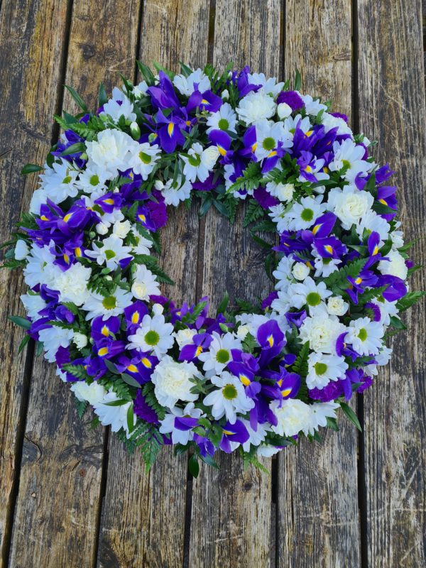 purple white wreath-flower wreath-iris-carnations-funeral flowers-florist Torquay-Torbay