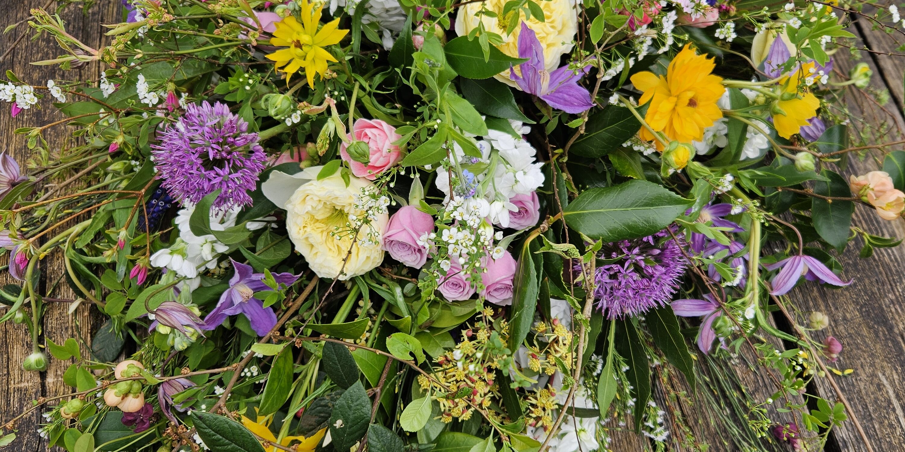 natural garden flowers in mixed colours for a funeral